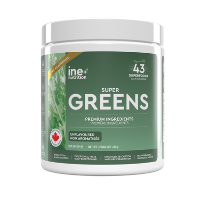 A white plastic tub of ine nutrition Super Greens powder with a green label, shown on a plain white background.